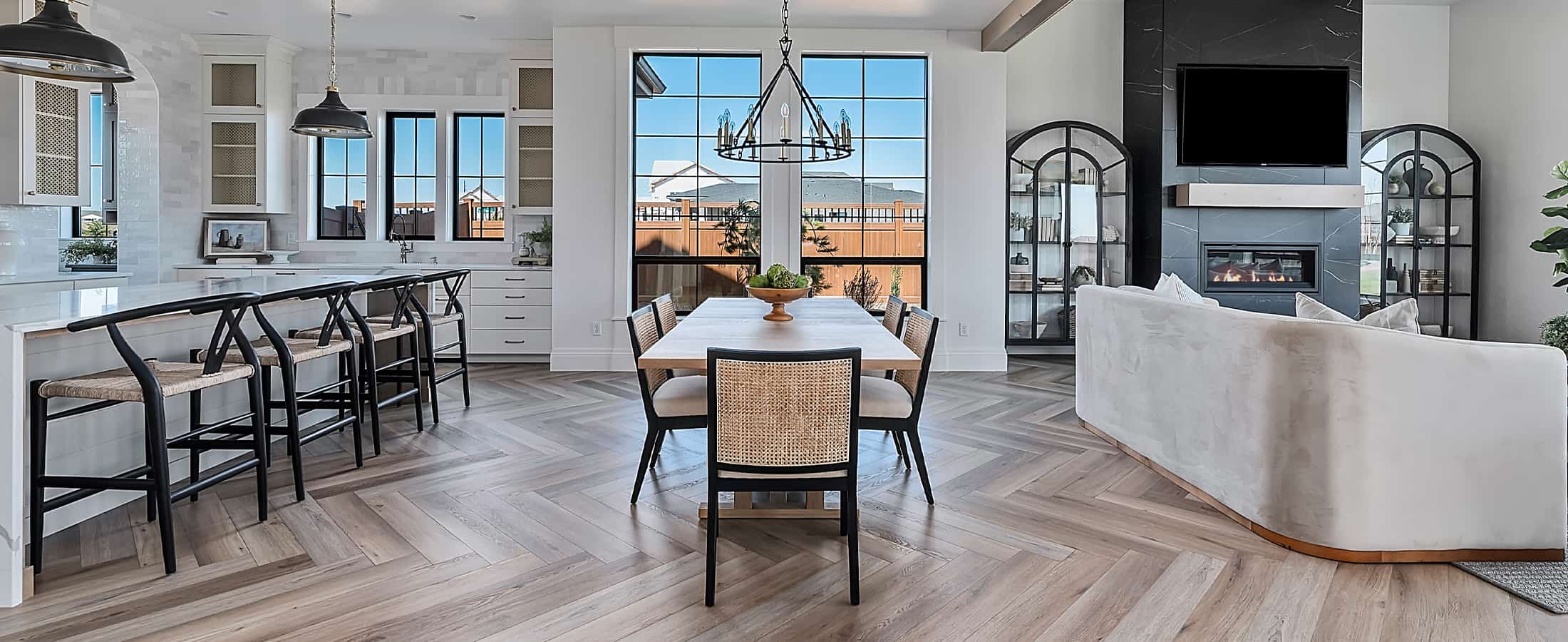 Natural hardwood flooring in a modern open-concept kitchen and living room.