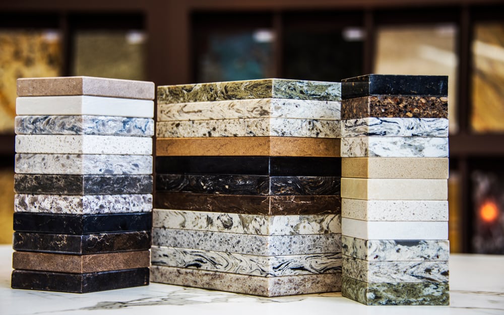 Variety of granite countertop samples showcasing different colors and patterns for flooring and kitchen surfaces.
