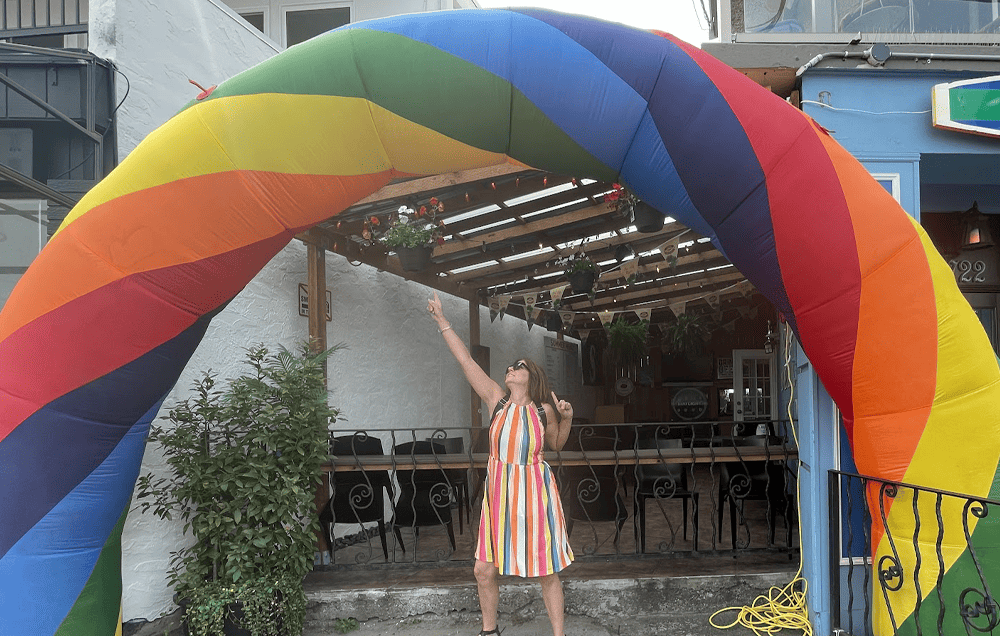 Rainbow arch over outdoor seating area at Dallas Watson Flooring.