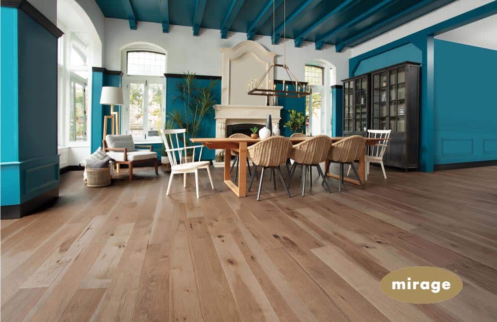 Smooth hardwood flooring in a stylish, modern living room featuring blue accents and cozy furniture.