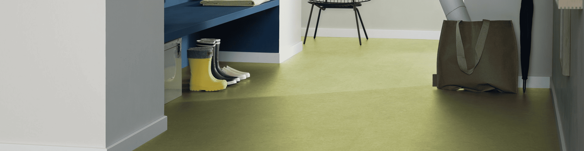 marmoleummarblesheet Colorful indoor flooring in a modern home with storage and decorative elements.