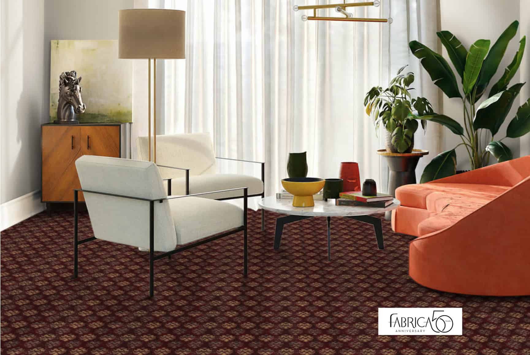 Screenshot Vibrant indoor living room with patterned carpet, modern furniture, and lush green plants.