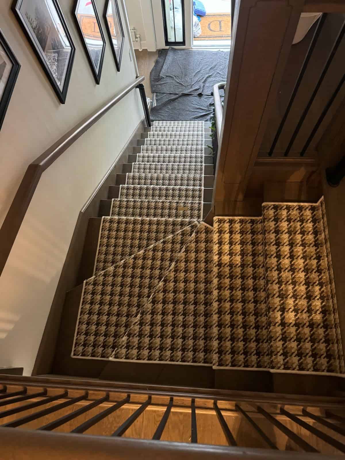 Houndstooth patterned stair carpet in home interior.